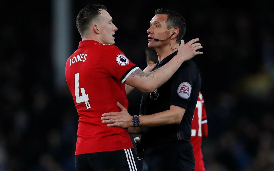 Andre Marriner (R) was one of many referees who was given a hugely demanding festive schedule - Action Images via Reuters