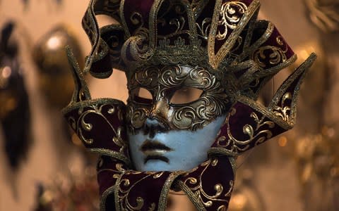 A traditional Venetian mask - Credit: AP