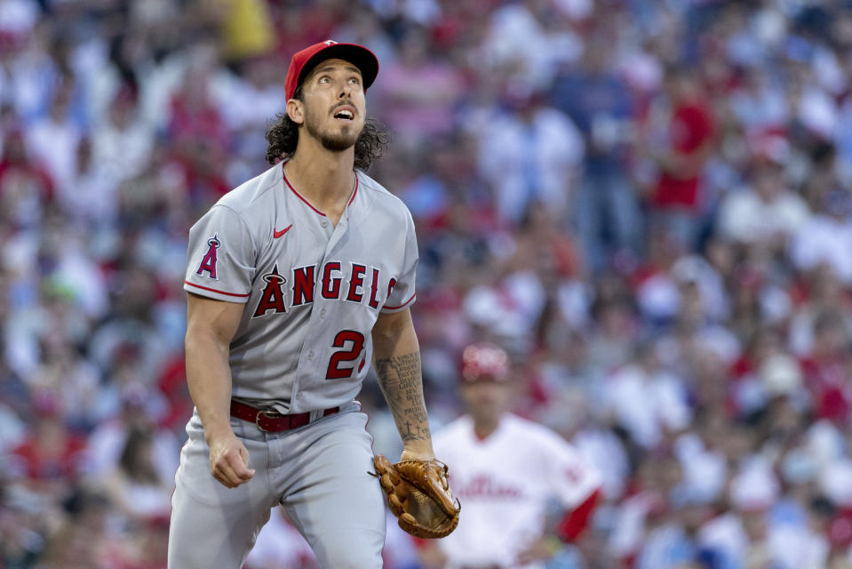 Los Angeles Angels starting pitcher Michael Lorenzen watches a fly ball during the first inning of a baseball game against the Philadelphia Phillies, Saturday, June 4, 2022, in Philadelphia. (AP Photo/Laurence Kesterson)