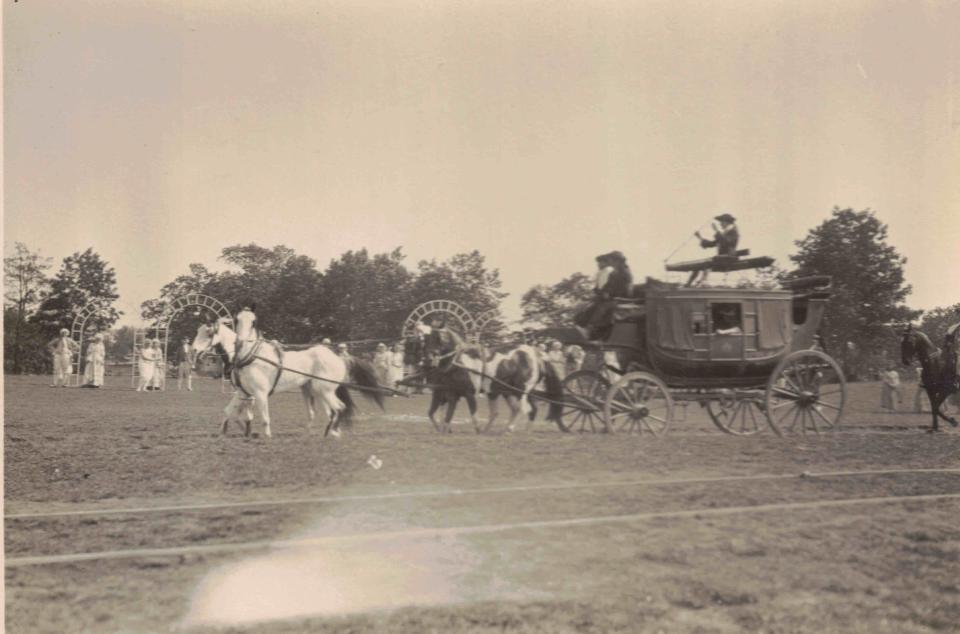 A historical pageant during Quincy's 1925 tricentennial celebration included a horse-drawn coach.