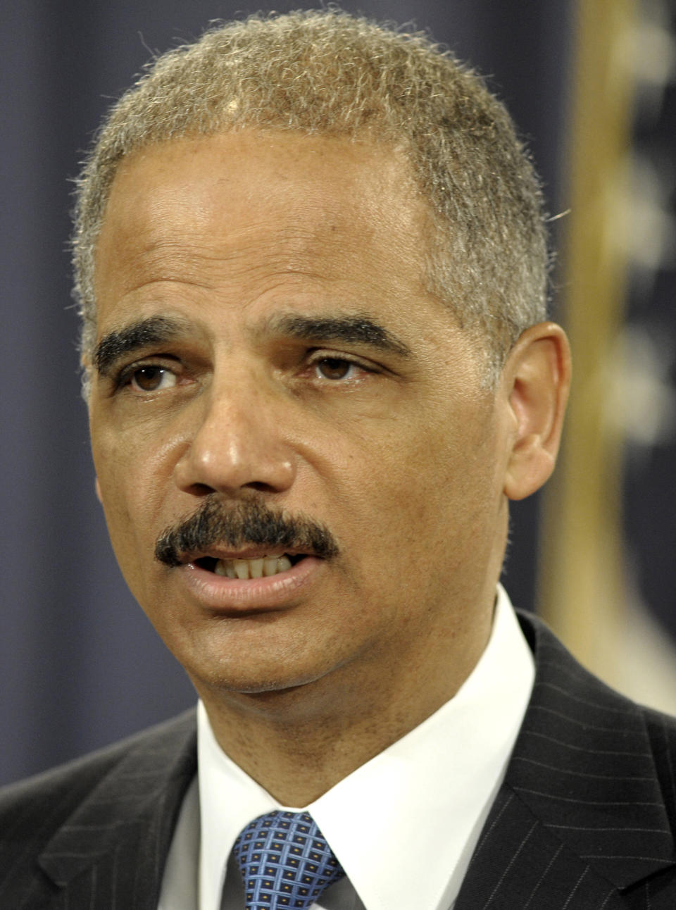 Attorney General Eric Holder speaks during a news conference at the Justice Department in Washington, Wednesday, April 11, 2012. The Justice Department and several states have sued Apple Inc. and major book publishers, alleging a conspiracy to raise the price of electronic books that Attorney General Eric Holder says cost consumers millions of dollars. (AP Photo/Cliff Owen)