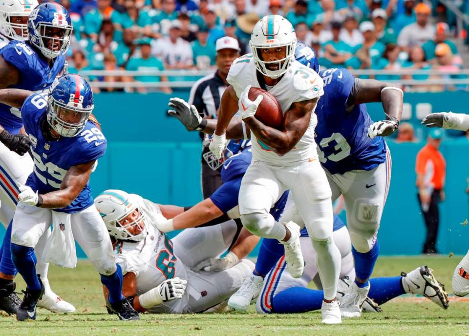 Miami Dolphins running back Raheem Mostert (31) carries for a first down in the second half against the New York Giants at Hard Rock Stadium in Miami Gardens on Sunday, October 8, 2023.