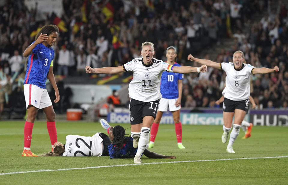 Germany's Alexandra Popp celebrates scoring her side's second goal during the Women Euro 2022 semifinal soccer match between Germany and France at Stadium MK in Milton Keynes, England, Wednesday, July 27, 2022. (Nick Potts/PA via AP)