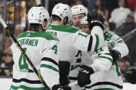 Dallas Stars celebrate after Dallas Stars center Luke Glendening, right, scored against the Vegas Golden Knights during the first period of Game 5 of the NHL hockey Stanley Cup Western Conference finals Saturday, May 27, 2023, in Las Vegas. (AP Photo/John Locher)