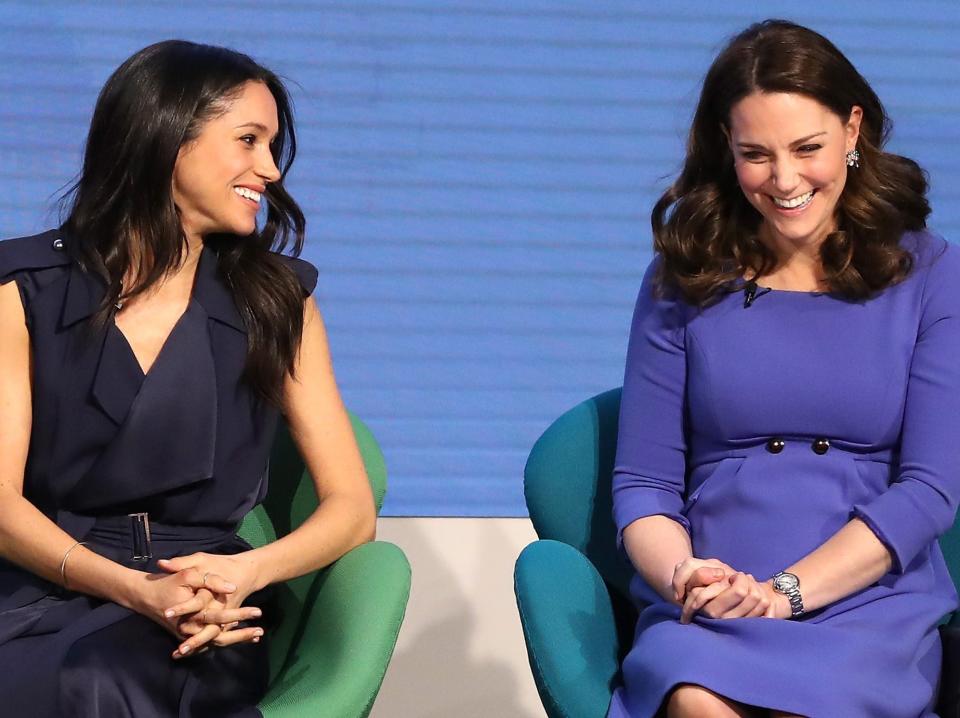 US actress and fiancee of Britain's Prince Harry Meghan Markle (L) and Britain's Catherine, Duchess of Cambridge attend the first annual Royal Foundation Forum on February 28, 2018 in London