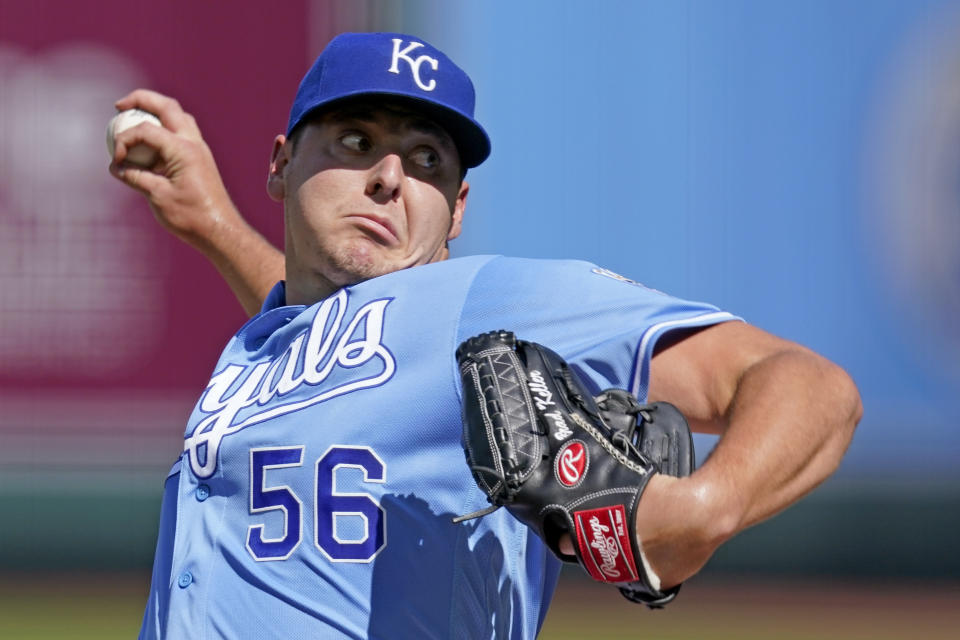 Kansas City Royals starting pitcher Brad Keller throws during the first inning of game one of a baseball doubleheader against the Cincinnati Reds Wednesday, Aug. 19, 2020, in Kansas City, Mo. (AP Photo/Charlie Riedel)