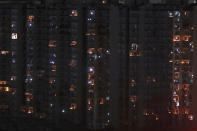 Balconies are illuminated with candles and torches to mark the country's fight against COVID-19 in Greater Noida, a suburb of New Delhi, India, April 5, 2020. Indian Prime Minister Narendra Modi had in a Friday broadcast urged the country's 1.3 billion people to switch off lights of their home at 9 pm for 9 minutes on Sunday night and light candles, lamps and even use mobile torches standing in their balconies. Modi said that such a gesture will dispel the darkness created by the coronavirus and show that people are together in their fight against the epidemic. (AP Photo/Altaf Qadri)