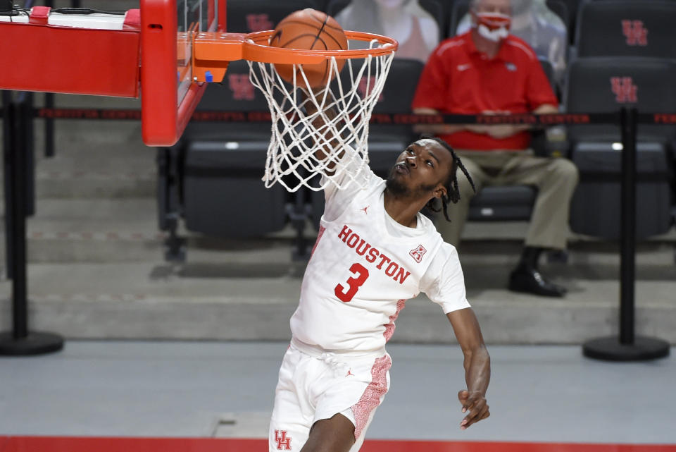 Houston guard DeJon Jarreau dunks during the second half of an NCAA college basketball game against Lamar, Wednesday, Nov. 25, 2020, in Houston. (AP Photo/Eric Christian Smith)