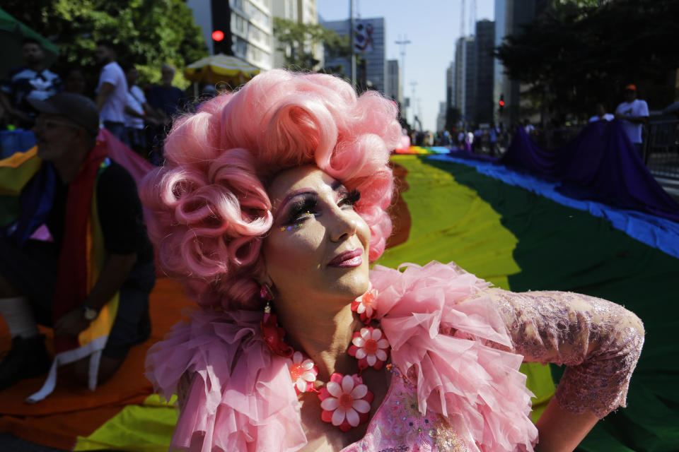 A reveler poses for a picture during the annual gay pride parade along Paulista avenue in Sao Paulo, Brazil, Sunday, June 23, 2019. (AP Photo/Nelson Antoine)