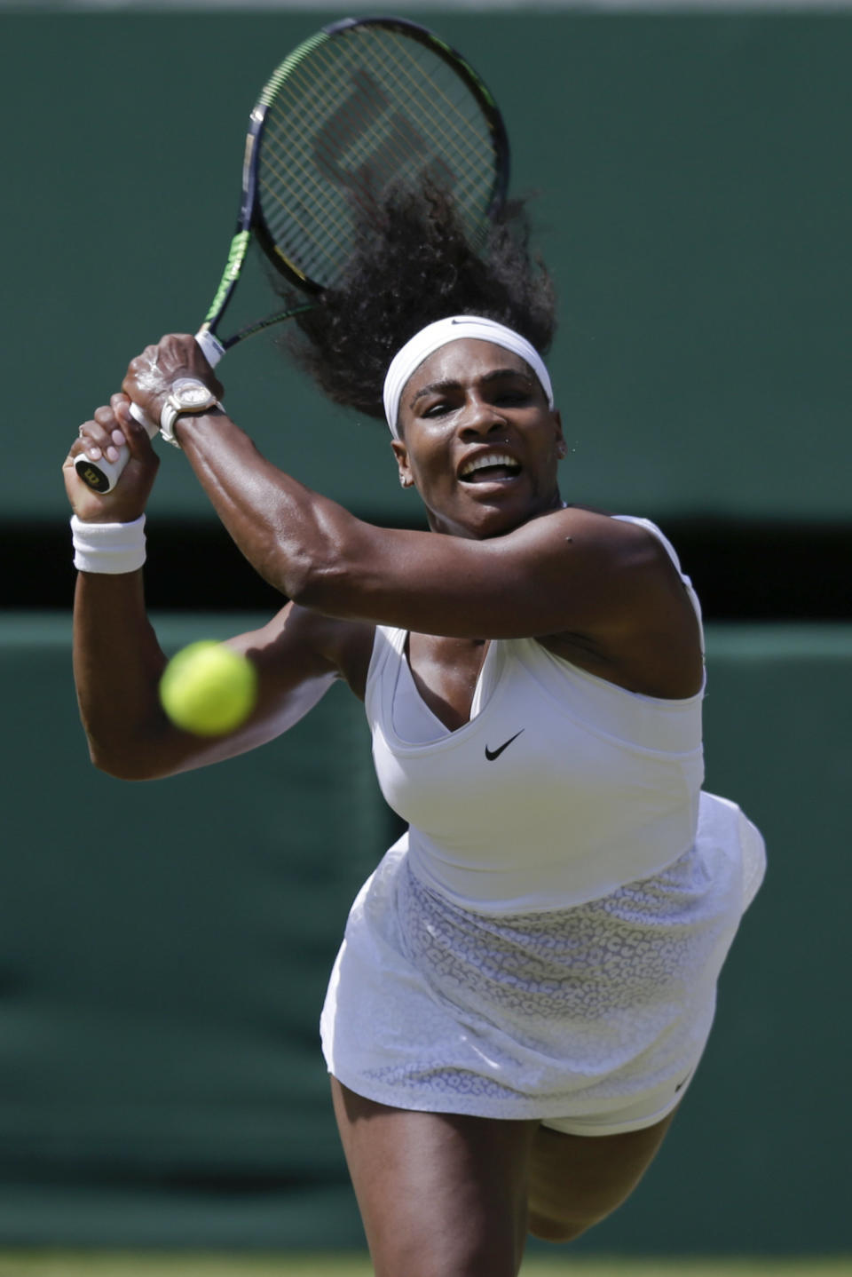 Serena Williams of the United States makes a return to Garbine Muguruza of Spain during the women's singles final at the All England Lawn Tennis Championships in Wimbledon, London, Saturday July 11, 2015. (AP Photo/Pavel Golovkin)