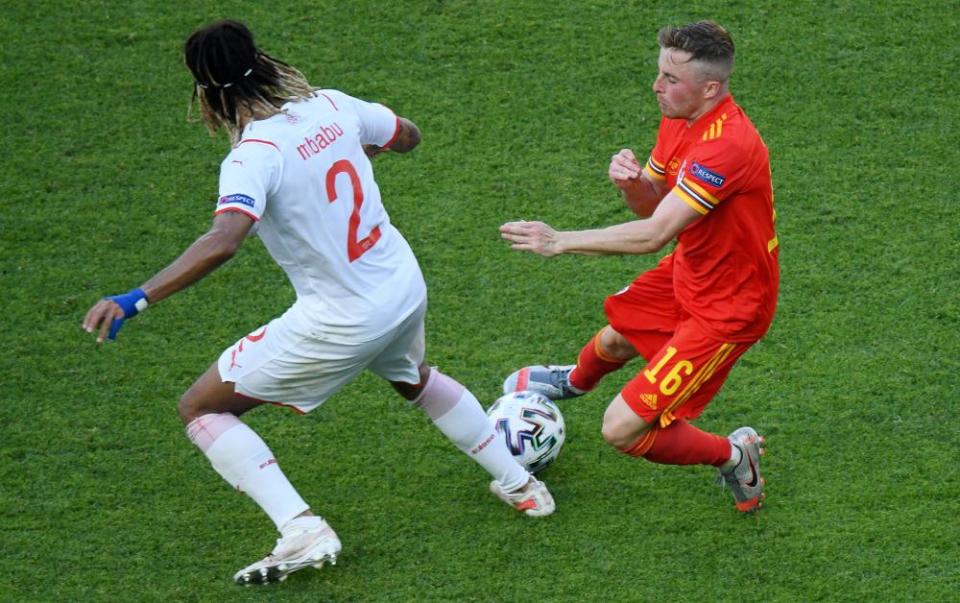 Joe Morrell battles for possession with Switzerland’s Kevin Mbabu.