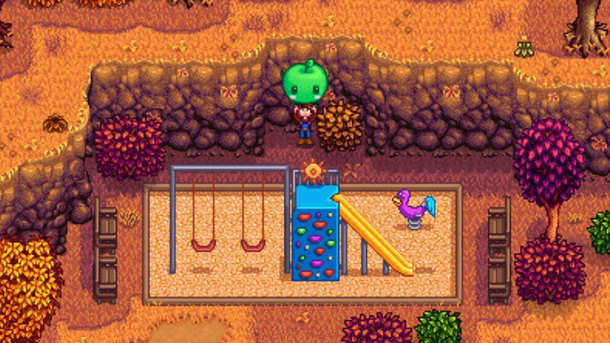  Stardew Valley player holding up a Jumino plush in a playground 