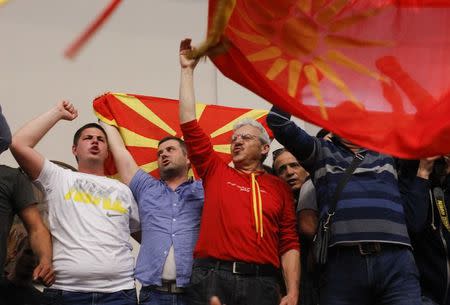 Protesters entered Macedonia's parliament after the governing Social Democrats and ethnic Albanian parties voted to elect an Albanian as parliament speaker in Skopje. Macedonia April 27, 2017. REUTERS/Ognen Teofilovski