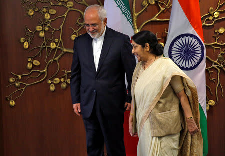 Iran's Foreign Minister Mohammad Javad Zarif and his Indian counterpart Sushma Swaraj walk after a photo opportunity in New Delhi, India, May 28, 2018. REUTERS/Altaf Hussain