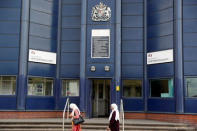 Women walk past HMP Birmingham after the British government took over its running from G4S in Birmingham, United Kingdom August 20, 2018. REUTERS/Darren Staples