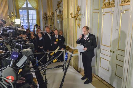 Peter Englund, permanent secretary of the Swedish Academy, steps out of his office to announce French writer Patrick Modiano as the winner of the 2014 Nobel Prize for Literature in Stockholm October 9, 2014. REUTERS/Anders Wiklund/TT News Agency