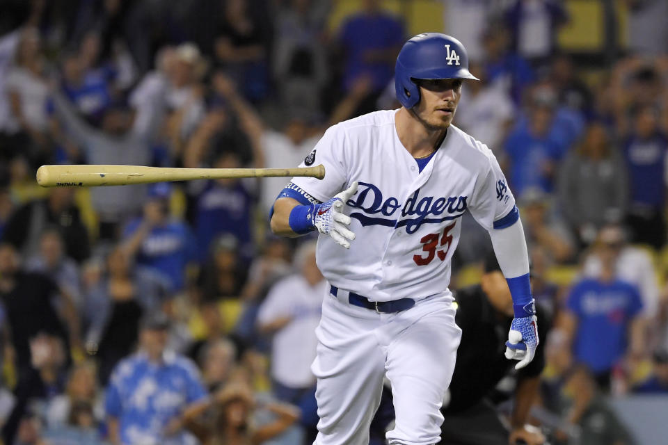 FILE - In this Sept. 18, 2019, file photo, Los Angeles Dodgers' Cody Bellinger tosses his bat as he runs to first after hitting a solo home run during the eighth inning of the team's baseball game against the Tampa Bay Rays in Los Angeles. the National League MVP figures to come down Christian Yelich of the Brewers and Bellinger, with Anthony Rendon of the Nationals possibly in the mix as well. (AP Photo/Mark J. Terrill, File)