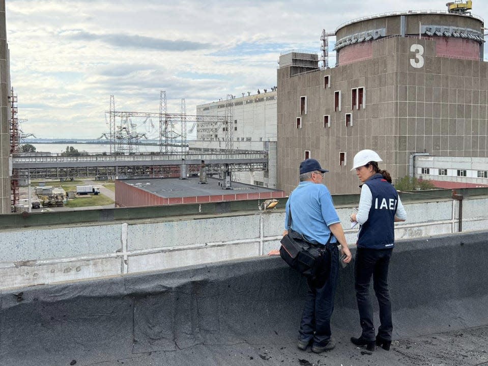 IAEA Deputy Director General, Head of Department of Nuclear Safety and Security, Lydie Evrard, with IAEA staff visiting roof top of the special building at the ZNPP that houses, among other items, the fresh nuclear fuel and the solid radioactive waste storage facility.