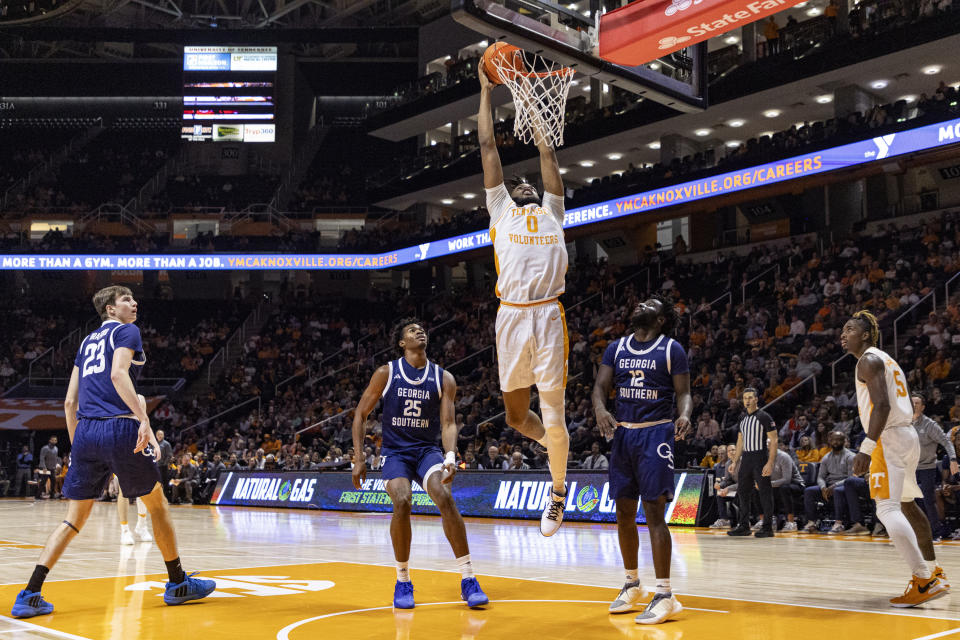 Tennessee forward Jonas Aidoo (0) dunks past Georgia Southern forward Avantae Parker (25) and guard Tyren Moore (12) during the first half of an NCAA college basketball game Tuesday, Dec. 12, 2023, in Knoxville, Tenn. (AP Photo/Wade Payne)