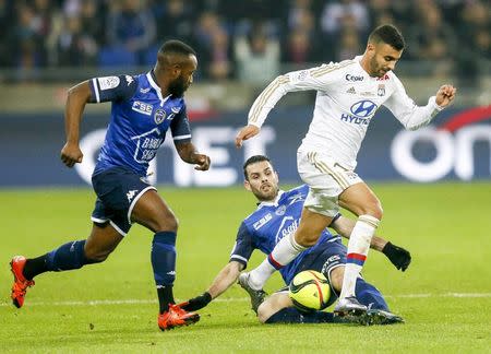 Football Soccer - Olympique Lyon v Troyes - French Ligue 1 - Grand Stade stadium, Decines, France - 9/1/2016 Olympique Lyon's Rachid Ghezzal (R) in action against Troyes' Yoann Court REUTERS/Robert Pratta