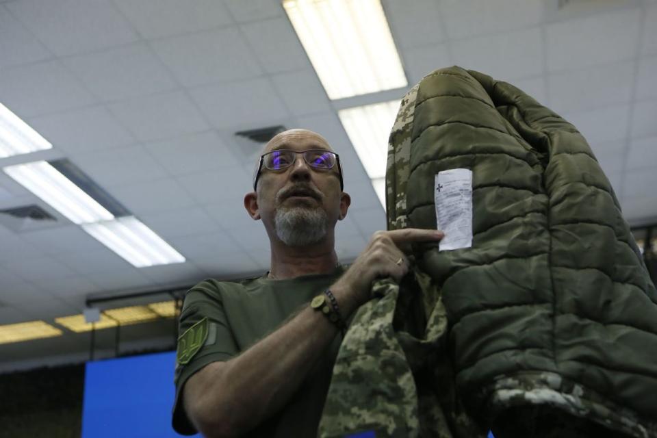 Ukraine’s Defense Minister Oleksii Reznikov holds up an army winter jacket at a press conference on Aug. 28, 2023, in Kyiv. Reznikov claims soldiers had no complaints about the quality of this uniform contrary to the allegations that jackets were of poor quality and bought at inflated prices. (Oleksandr Magula/Suspilne.Media)