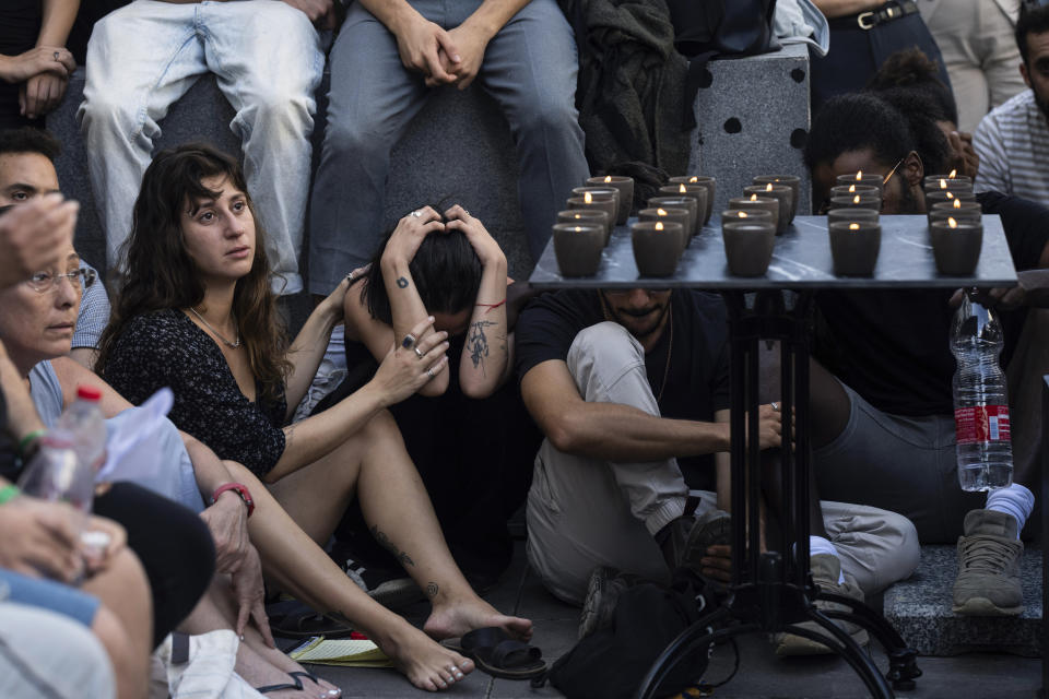 Mourners attend a funeral of the Israeli man Ziv Shapira who was killed by Hamas militants, outside a bar in Tel Aviv, Israel , on Thursday, Oct. 19, 2023. (AP Photo/Petros Giannakouris)