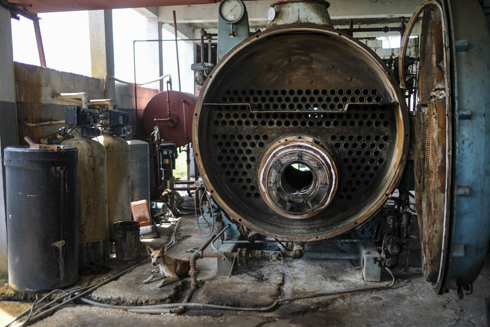 Machinery sits at a vetiver oil factory after it was made inoperable by the 7.2 magnitude earthquake in Les Cayes, Haiti, Thursday, Aug. 19, 2021. Many of the factories that contributed to the multimillion-dollar industry responsible for more than half the world's vetiver oil used in fine perfumes, cosmetics, soaps and aromatherapy, are now inoperable. (AP Photo/Matias Delacroix)