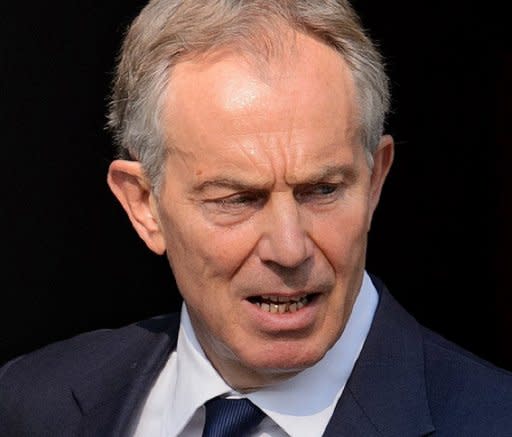 Former British premier Tony Blair leaves his home in central London as he prepares to give evidence to the Leveson Inquiry. Blair said he made a strategic decision not to take on the power of the media during his time in office, as he testified at the press ethics inquiry