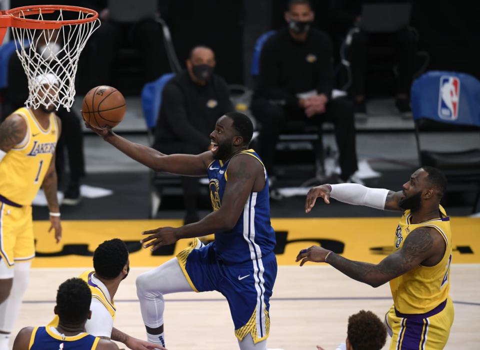 <div class="inline-image__caption"><p>Draymond Green #23 of the Golden State Warriors scores on a layup past LeBron James #23 of the Los Angeles Lakers during a 115-113 Warriors win on Martin Luther King Jr. Day at Staples Center on January 18, 2021, in Los Angeles, California. </p></div> <div class="inline-image__credit">Harry How/Getty</div>