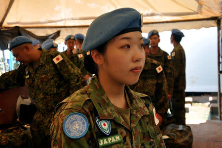 A Female Japanese soldier part of the last group of Japanese soldiers from the United Nations Mission in South Sudan (UNMISS) waits at the Juba International Airport before boarding a plane, as Japan withdraws from a mission in South Sudan, in Juba, South Sudan May 25, 2017. REUTERS/Jok Solomun