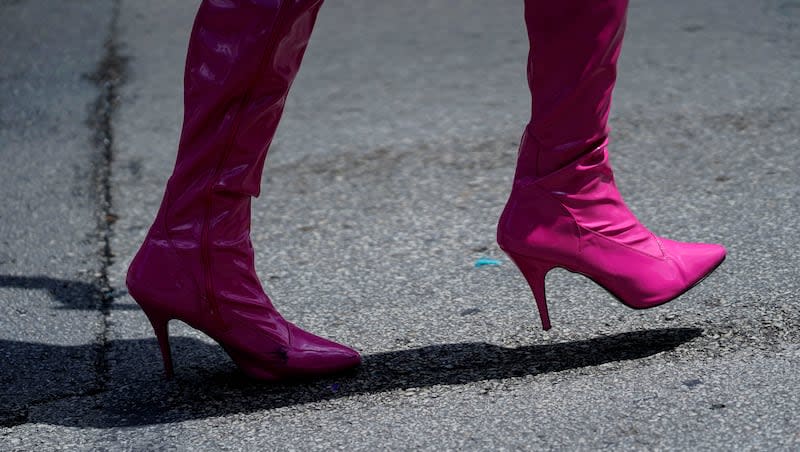 A paradegoer wears pink high-heeled shoes during Chicago's 52nd annual Pride Parade Sunday, June 25, 2023, in Chicago.