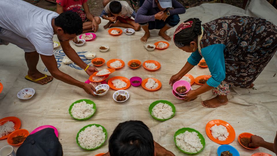 Displaced families prepare food after attending prayer service to celebrate Eid al-Adha in Mamasapano, Central Mindanao, Philippines, on August 21, 2018. Muslims worldwide mark Eid Al-Adha, to commemorate the Prophet Ibrahim's readiness to sacrifice his son as a sign of his obedience to God, during which they sacrifice permissible animals, generally goats, sheep, and cows. - Jes Aznar/Getty Images/File