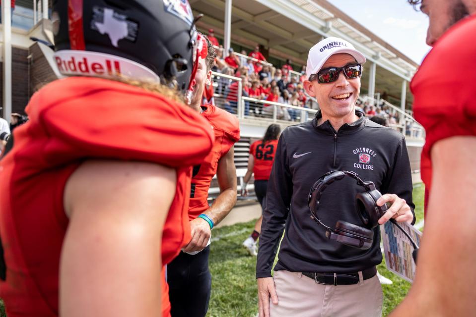 Grinnell College head football coach Brent Barnes talks to offensive players on the sidelines during their game against Beloit on Oct. 1 in Grinnell, Iowa. Grinnell won the game 28-20, moving to 2-1 for the season.