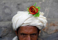 An artificial flower is seen on a turban of a peace marcher as he arrives in Kabul, Afghanistan June 18, 2018. REUTERS/Mohammad Ismail