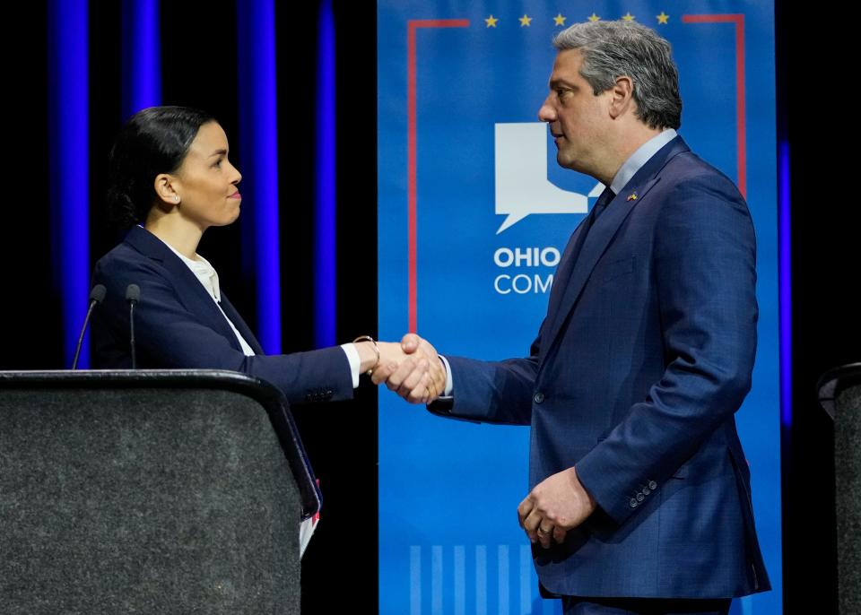 U.S. Senate Democratic candidates Morgan Harper, left, and Rep. Tim Ryan (D-OH), right, shake hands at the end of Ohio's U.S. Senate Democratic Primary Debate at Central State University.