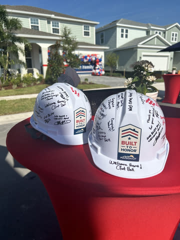 Notes of love on hard hats for both Built to Honor recipients (Photo: Business Wire)