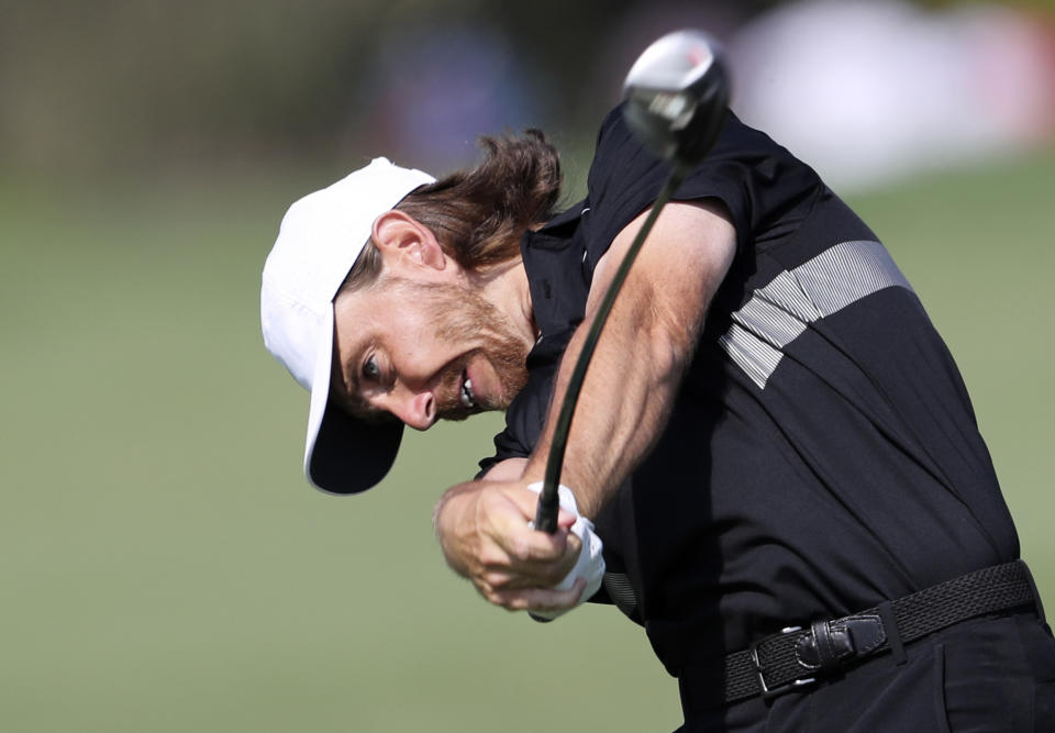 England's Tommy Fleetwood plays a shot on the 2nd hole during the second round of the DP World Tour Championship golf tournament in Dubai, United Arab Emirates, Friday, Nov. 22, 2019. (AP Photo/Kamran Jebreili)