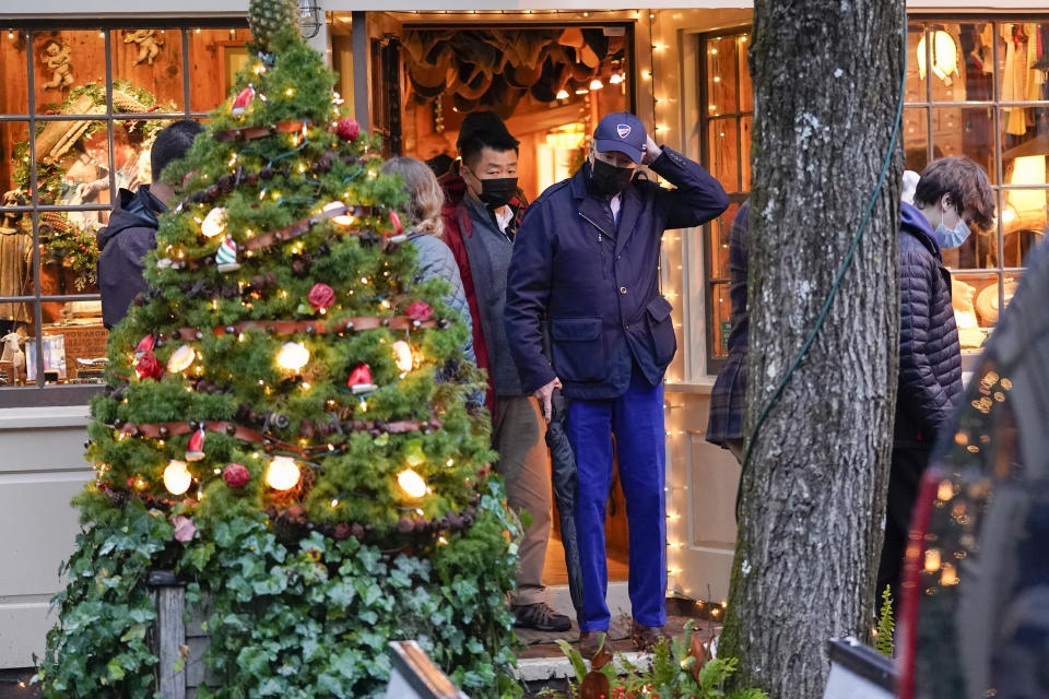 President Joe Biden walks out of a shop as he visits Nantucket, Mass., with family Friday, Nov. 26, 2021. (AP Photo/Carolyn Kaster)