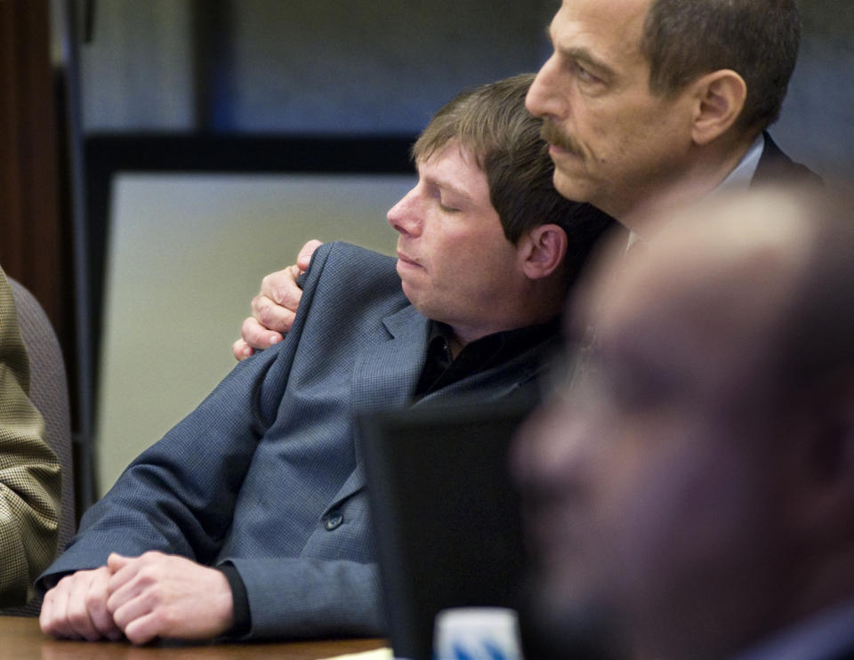 FILE - In this April 13, 2010 file photo, Kerry Lewis, left, leans into his lawyer Paul Mones after the verdict against the Boy Scouts of America was announced in a sexual abuse case in Portland, Ore. The Boy Scouts of America has filed for bankruptcy protection as it faces a barrage of new sex-abuse lawsuits. The filing Tuesday, Feb. 18, 2020, in Wilmington, Del., is an attempt to work out a potentially mammoth compensation plan for abuse victims that will allow the 110-year-old organization to carry on. "There are a lot of very angry, resentful men out there who will not allow the Boy Scouts to get away without saying what all their assets are," said lawyer Paul Mones, who represents numerous clients suing the BSA. "They want no stone unturned." (Jamie Francis/The Oregonian via AP, File)