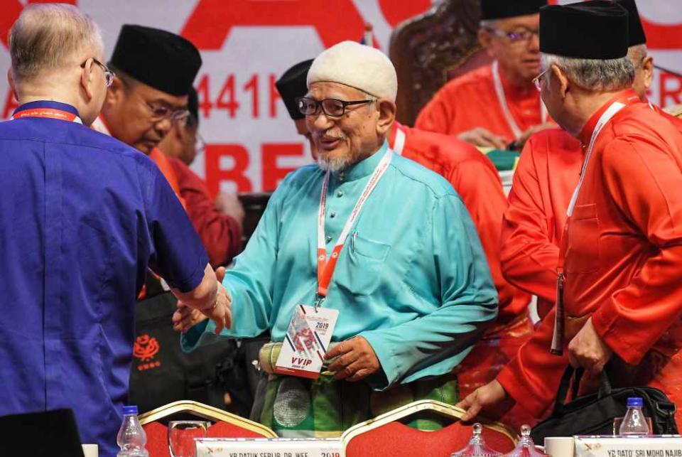 PAS president Datuk Seri Abdul Hadi Awang arrive at the 2019 Umno General Assembly in Kuala Lumpur December 6, 2019. ― Picture by Shafwan Zaidon