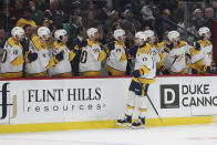 Nashville Predators center Mark Jankowski (17) high fives teammates after scoring a goal against the Minnesota Wild during the first period of an NHL hockey game Sunday, March 10, 2024, in St. Paul, Minn. (AP Photo/Stacy Bengs)