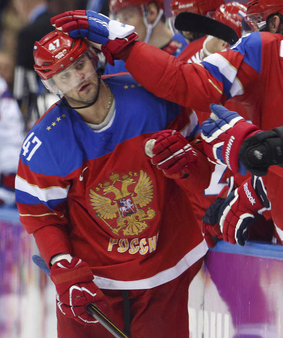 Russia forward Alexander Radulov is congratulated by teammates after scoring against Norway in the third period of a men's ice hockey game at the 2014 Winter Olympics, Tuesday, Feb. 18, 2014, in Sochi, Russia. (AP Photo/Mark Humphrey)