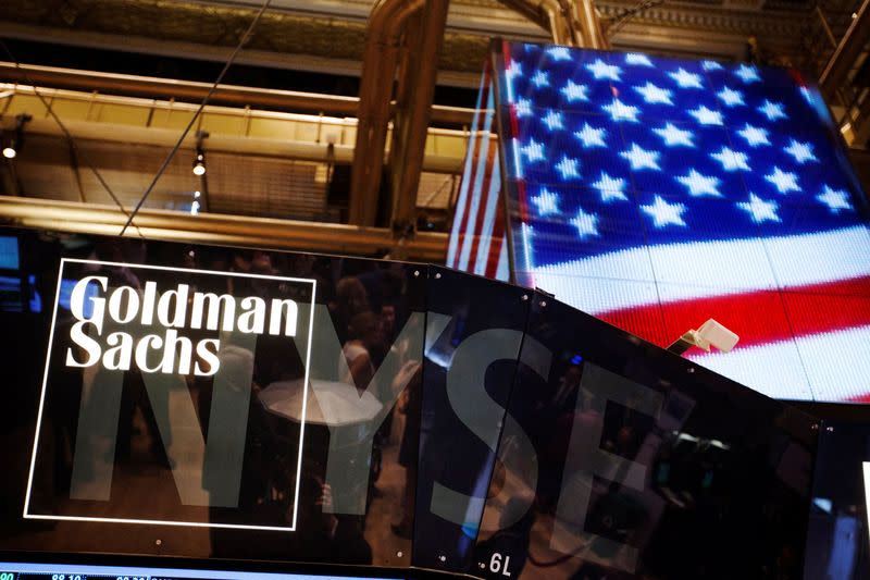 FILE PHOTO: The Goldman Sachs logo is displayed on a post above the floor of the New York Stock Exchange