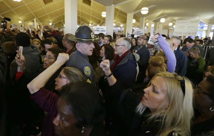 Demonstrators crowd the rotunda outside the House and Senate galleries during a special session at the North Carolina Legislature in Raleigh, N.C., Thursday, Dec. 15, 2016. (Photo: Gerry Broome/AP)