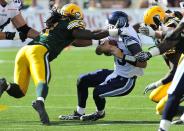 left to right - Edmonton Eskimos player # 91 (DL ) Marcus Howard goes after Toronto Argonauts player # 15 (QB ) Ricky Ray as he tries to get away from him during the 1st quarter of CFL game action between the Edmonton Eskimo's and the Toronto Argonauts at Commonwealth stadium in Edmonton June 30/2012 (CFL PHOTO / Walter Tychnowicz)