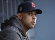 FILE - In this Oct. 28, 2018, file photo, Boston Red Sox manager Alex Cora waits for the start of Game 5 of the baseball World Series between the Red Sox and Los Angeles Dodgers in Los Angeles. Cora was fired by the Red Sox on Tuesday, Jan. 14, 2020, a day after baseball Commissioner Rob Manfred implicated him in the sport's sign-stealing scandal. (AP Photo/David J. Phillip, File)