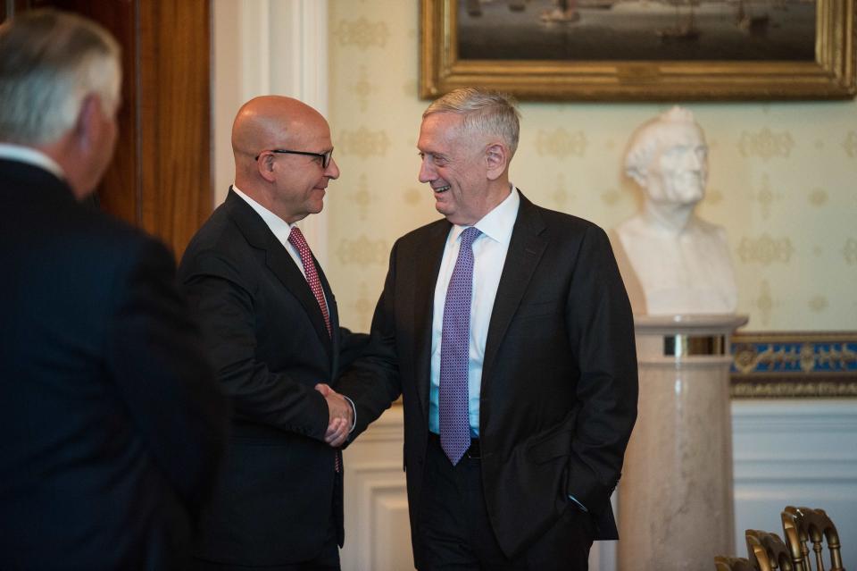 U.S. Defense Secretary Jim Mattis, at right, shakes hands with national security adviser H.R. McMaster. (Photo: AFP Contributor via Getty Images)