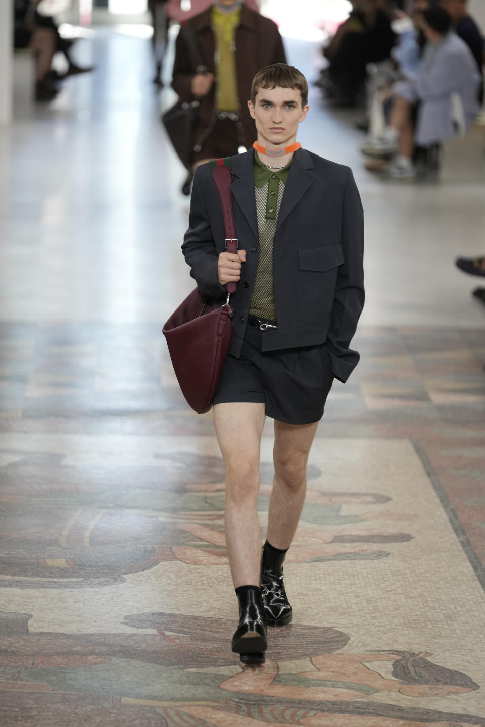 A model wears a creation as part of the Gucci men's Spring Summer 2025 collection, that was presented in Milan, Italy, Monday, June 17, 2024. (AP Photo/Luca Bruno).