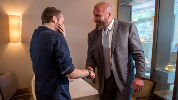 London police officer Charlie Guenigault meets Triple H. (Photo courtesy of WWE)