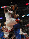 CHICAGO, IL - APRIL 21: Loul Deng #9 of the Chicago Bulls is fouled while shooting by Vince Carter #25 of the Dallas Mavericks at the United Center on April 21, 2012 in Chicago, Illinois. The Bulls defeated the Mavericks 93-83. NOTE TO USER: User expressly acknowledges and agress that, by downloading and/or using this photograph, User is consenting to the terms and conditions of the Getty Images License Agreement. (Photo by Jonathan Daniel/Getty Images)